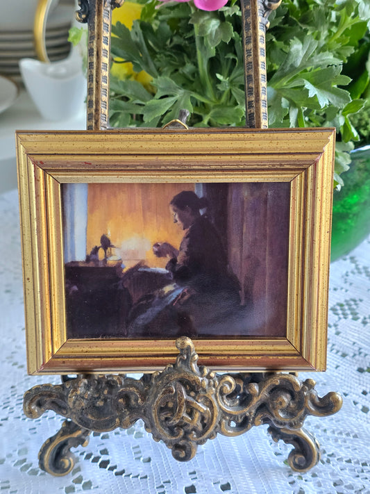 Harriet Backer paveikslo ,,Prie lempų šviesos" reprodukcija